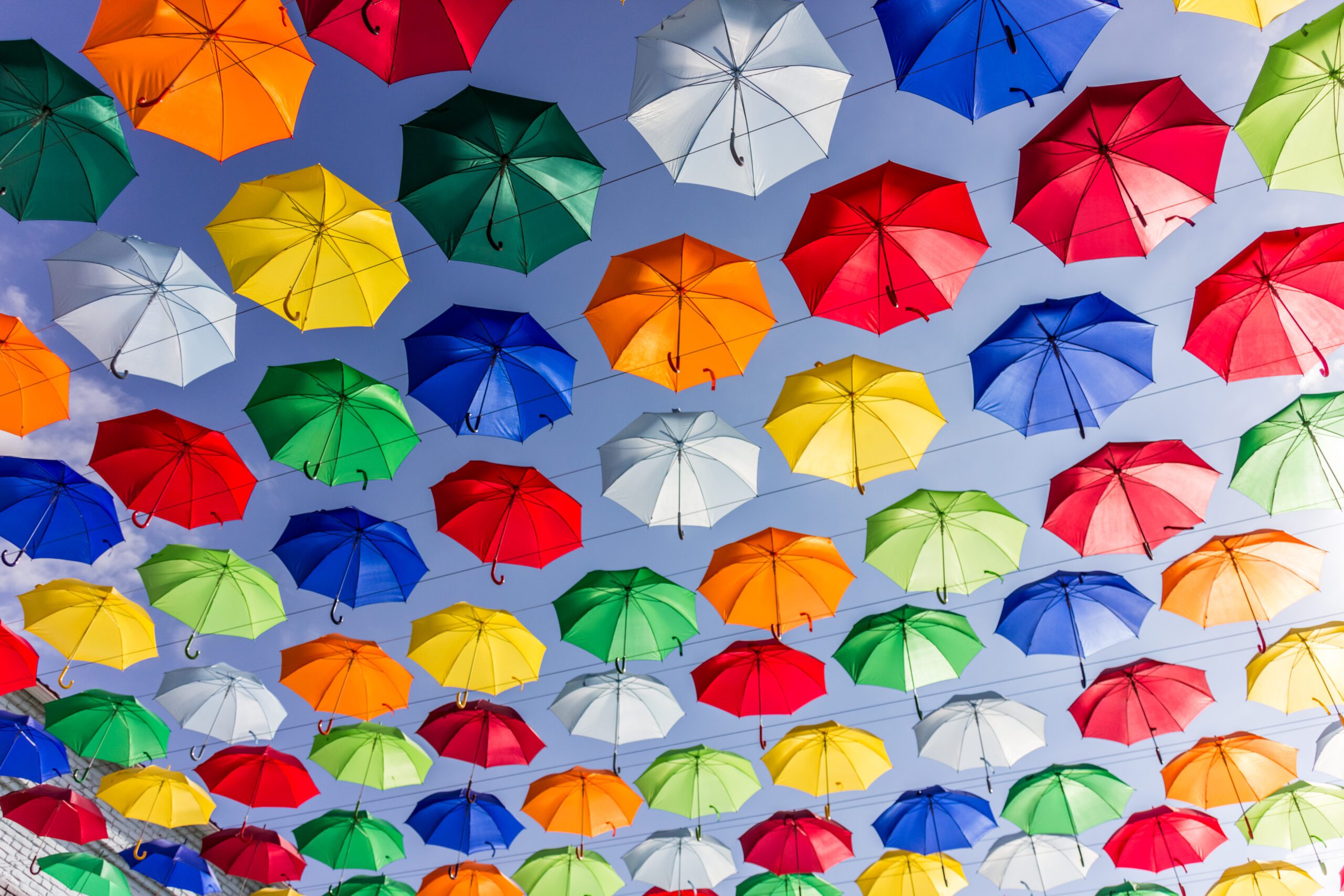 low-angle-view-multi-colored-umbrellas